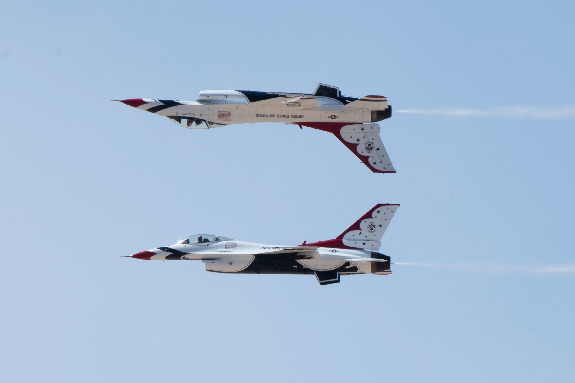 The U.S. Air Force Air Demonstration Squadron, known as the “Thunderbirds,” F-16 Fighting Falcon perform an aerial maneuver at the 2022 Holloman Legacy of Liberty Air Show and Open House May 7, 2022, at Holloman Air Force Base, New Mexico. The mission of the Thunderbirds is to recruit, retain and inspire, and travel across the country to showcase the Air Force mission. (U.S. Air Force photo by Airman Isaiah Pedrazzini)