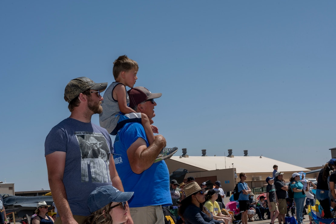 The Thatcher family observes the 2022 Legacy of Liberty Air Show and Open House, May 8, 2022, on Holloman Air Force Base, New Mexico. The air show is the first air show on Holloman in four years and the largest event held on the installation in 11 years. (U.S. Air Force photo by Senior Airman Adrian Salazar)