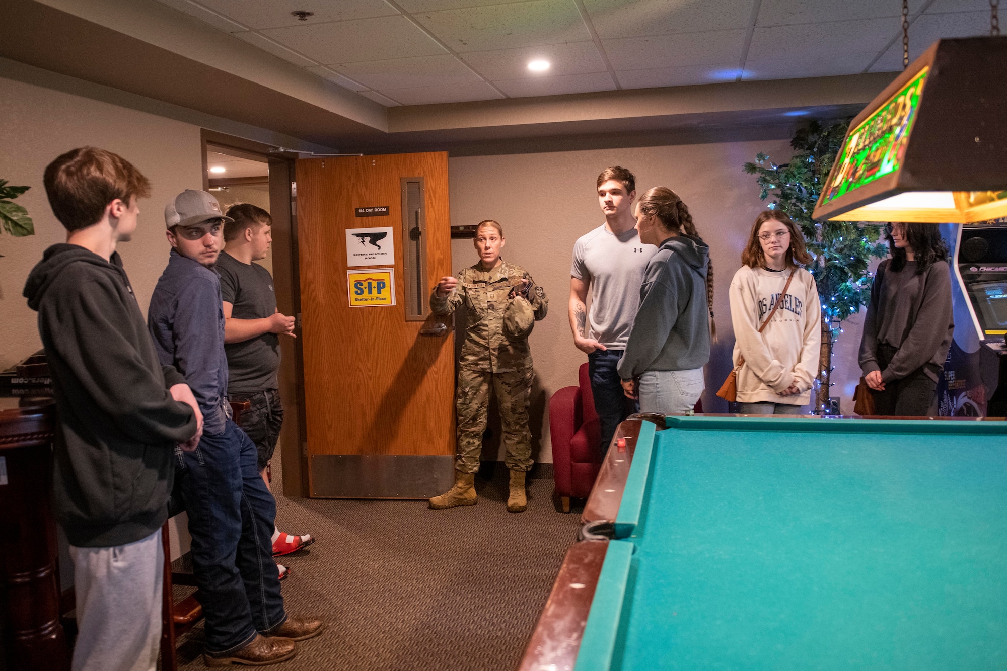 Prospective recruits from across Arkansas tour a dorm facility during a recruiting event