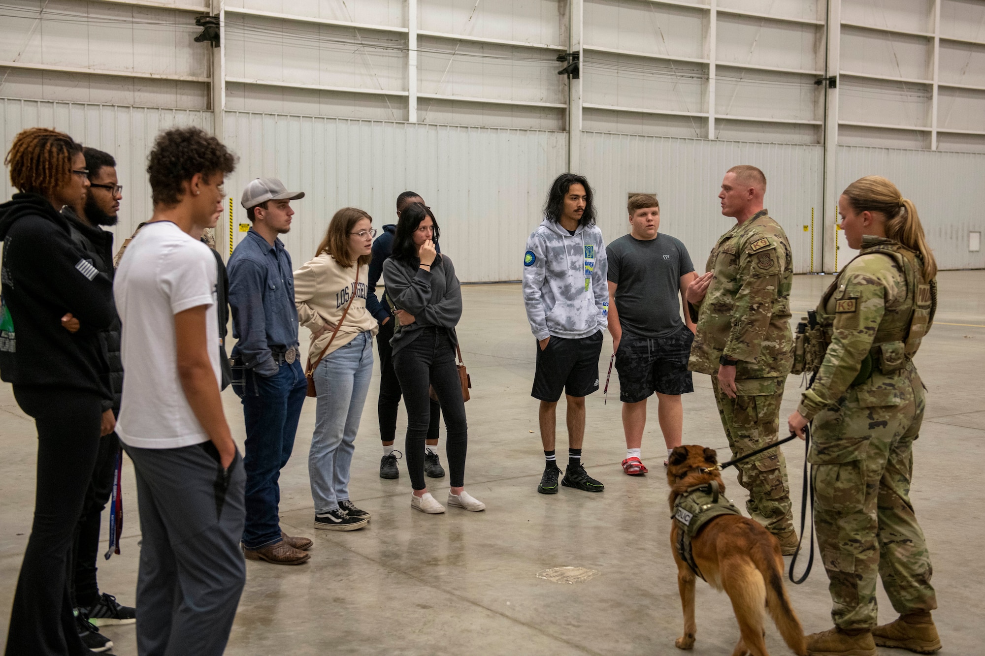 Airmen assigned to the 19th Security Forces Squadron talk with prospective recruits