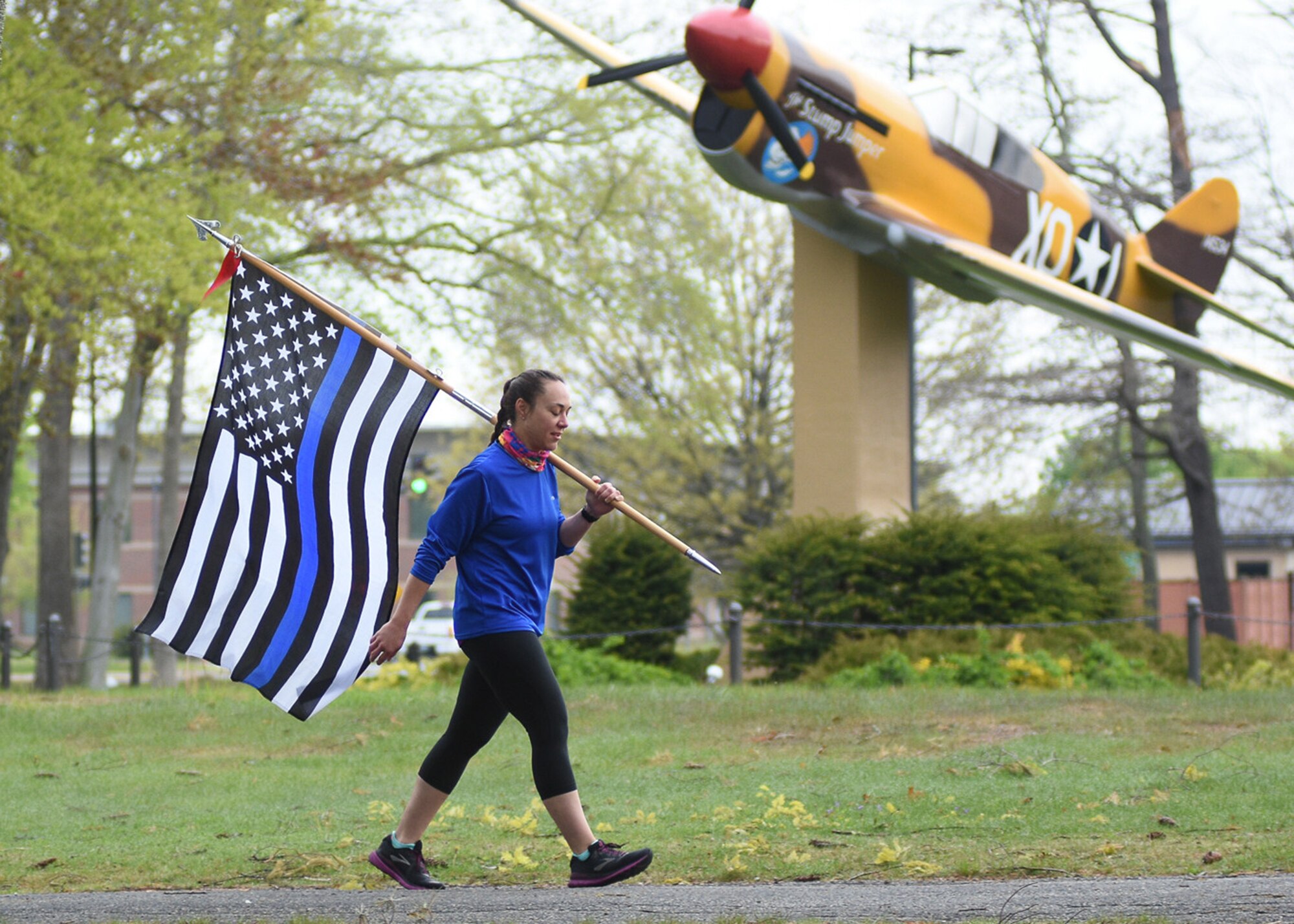 person carries a flag base static display