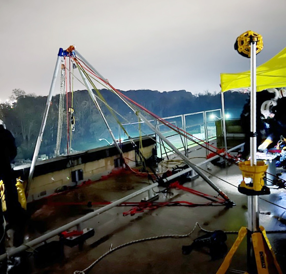 Cranes and other equipment in a nighttime search and rescue