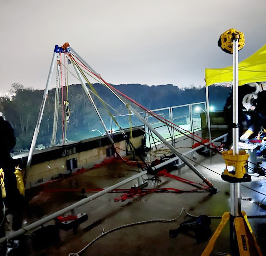 Cranes and other equipment in a nighttime search and rescue