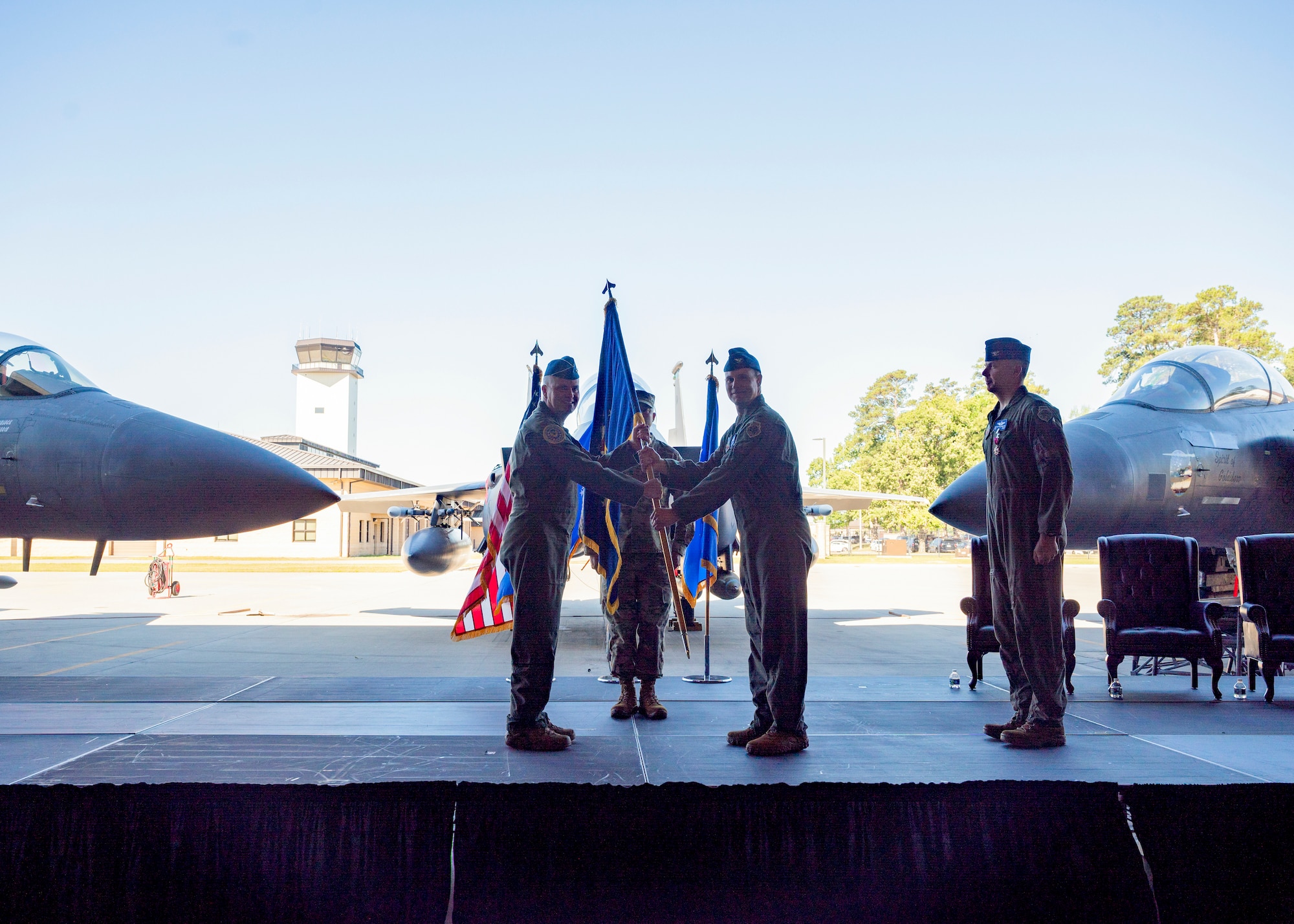 Maj. Gen. Michael G. Koscheski, left, Fifteenth Air Force commander, passes the guidon to Col. Lucas Teel, incoming 4th Fighter Wing commander, as he assumes command of the 4th FW during a Change of Command ceremony at Seymour Johnson Air Force Base, North Carolina, May 11, 2022. Prior to assuming command of the 4th FW, Teel was the vice commander of the 366th FW at Mountain Home AFB, Idaho. (U.S. Air Force photo by Senior Airman Kimberly Barrera)