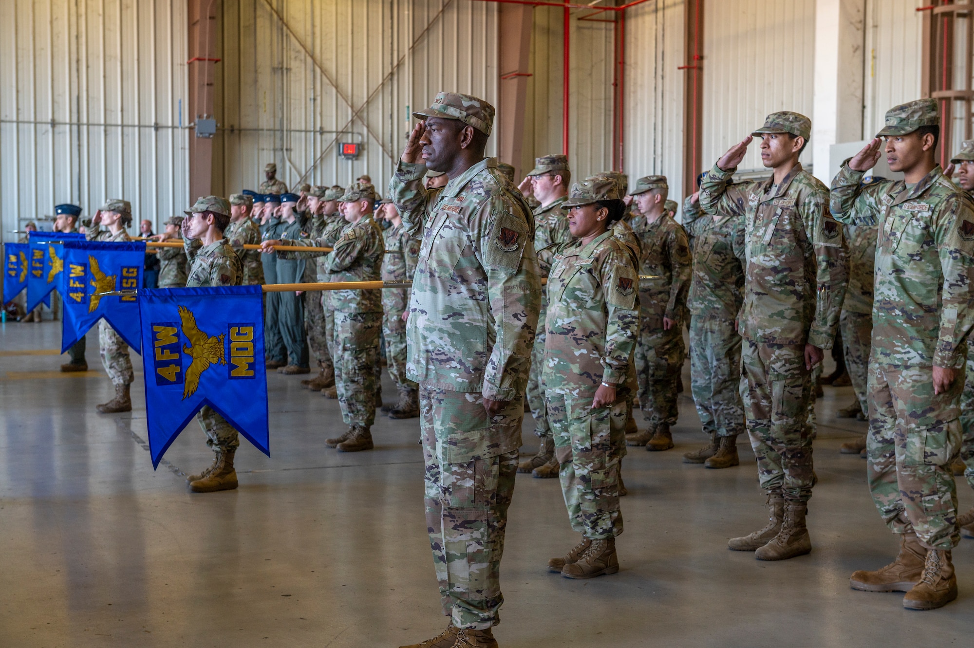 Airmen assigned to the 4th Fighter Wing salute Col. Lucas Teel, 4th FW commander, during the official Wing Change of Command ceremony at Seymour Johnson Air Force Base, North Carolina, May 11, 2022. Prior to assuming command of the 4th FW, Teel was the vice commander of the 366th FW at Mountain Home AFB, Idaho. (U.S. Air Force photo by Senior Airman Kylie Barrow)