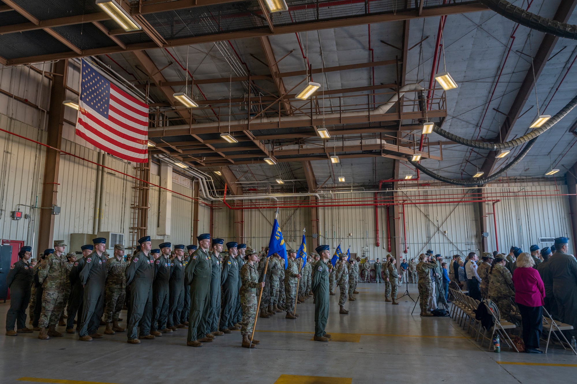 Members assigned to the 4th Fighter Wing stand during outgoing 4th Fighter Wing Commander, Col. Kurt Helphinstine, closing remarks before relinquishing command during the 4th FW Change of Command ceremony at Seymour Johnson Air Force Base, North Carolina, May 11, 2022. Helphinstine was the commander of the 4th FW for approximately two years. (U.S. Air Force photo by Senior Airman Kylie Barrow)