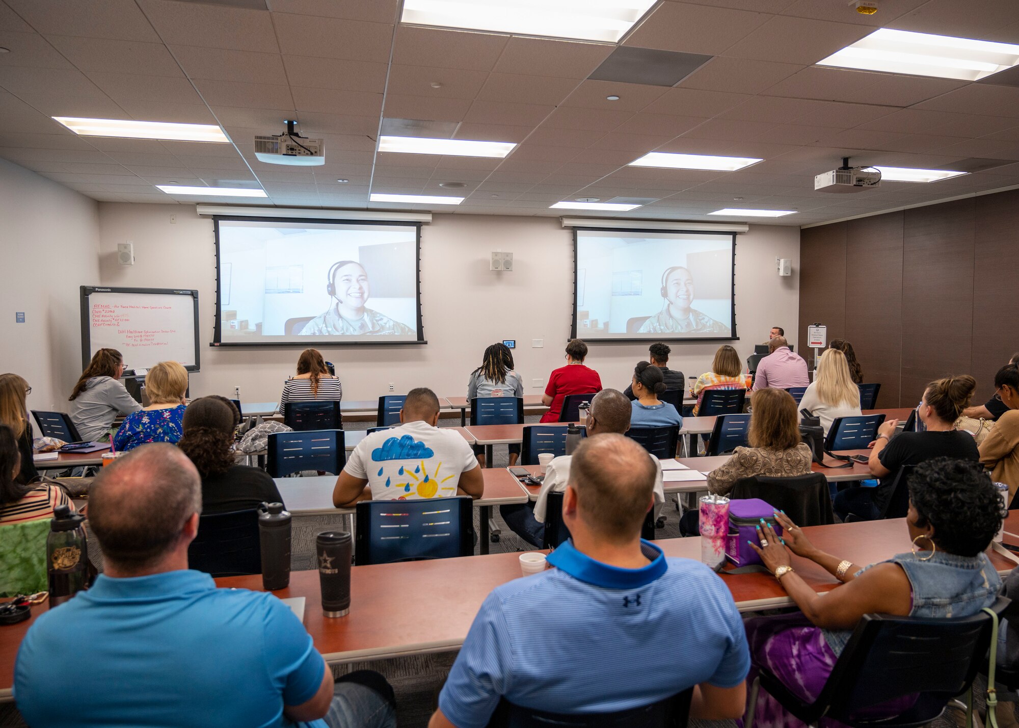 U.S. Air Force Master Sgt. Vanessa Flores, Air Force Personnel Center Headquarters medical retentions standards superintendent, instructs Air Force Medical Home personnel through Zoom during an AFMH Operations course, April 28, 2022, at Luke Air Force Base, Arizona.