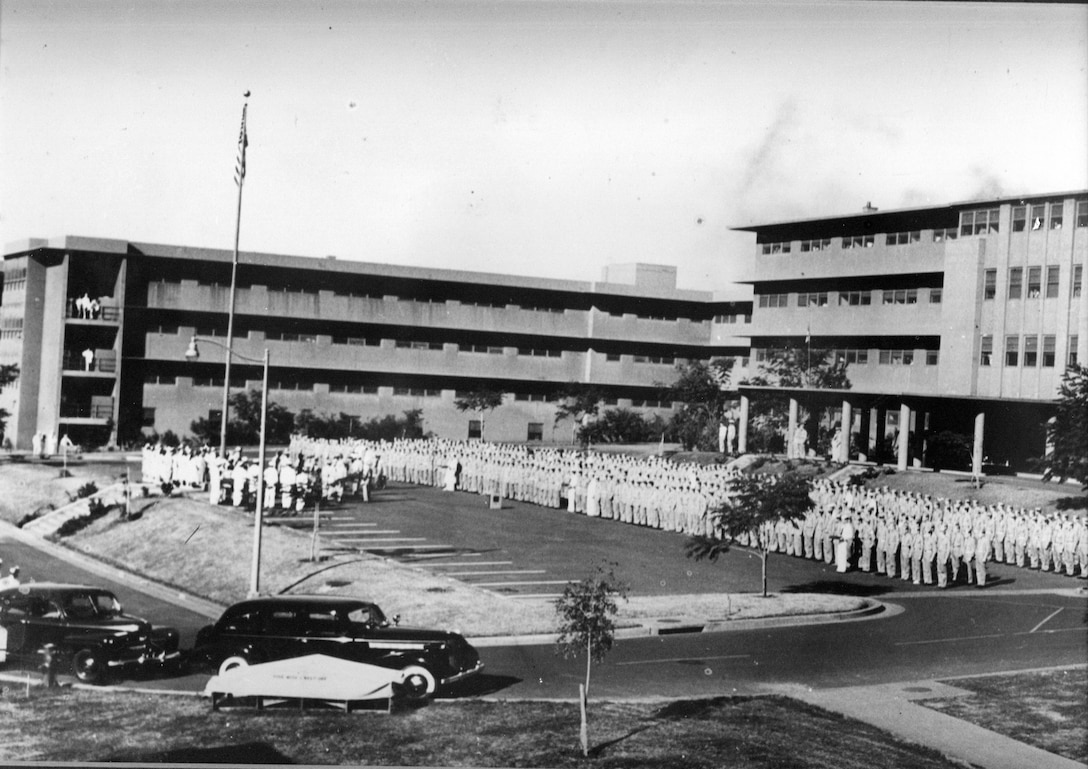 The Aiea Naval Hospital conducts an all-hands formation in front of the Aiea Heights Naval Hospital during World War II. On Jan. 1, 1944, Adm. Chester W. Nimitz ordered all able patients to assemble in front of the hospital in order to personally present the combat-wounded patients their awards. The building that currently headquarters U.S. Marine Corps Forces, Pacific was once the primary rear-area hospital for the Navy and Marine Corps during World War II.