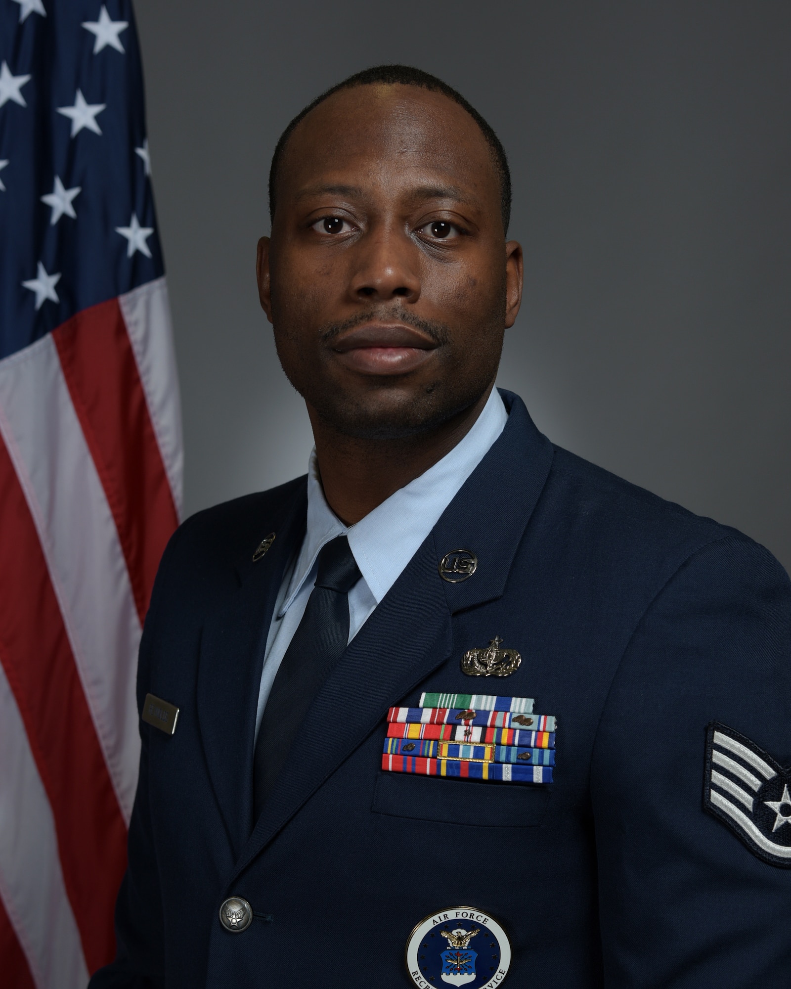 Staff Sgt. Jeremy Reynolds, an enlisted accessions recruiter based in Marion, Illinois, with the 345th Recruiting Squadron poses for an official portrait.