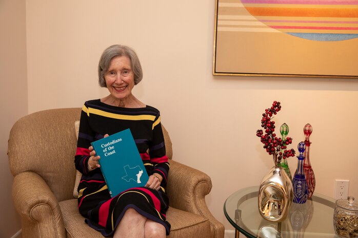 GALVESTON, Texas -- Lynn Alperin poses for a photo with a copy of her book, "Custodians of the Coast," at her home, April 7. The retired medical writer recently gifted the U.S. Army Corps of Engineers (USACE) Galveston District’s historical archives a signed copy of her book after learning there weren’t any copies left in its libraries. For a long time, Alperin’s book was considered required reading for incoming district commanders.

Photo by Carlos Gomez