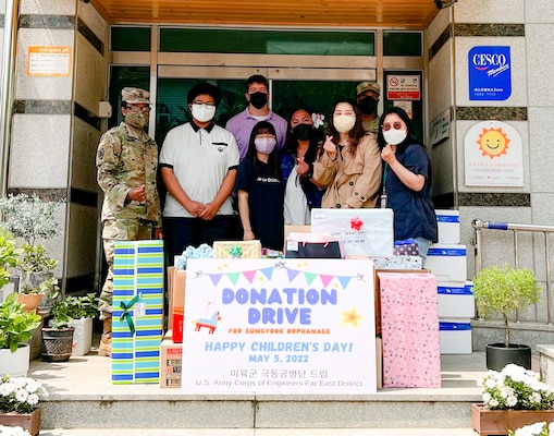 Volunteers from the U.S. Army Corps of Engineers Far East District pose for a group photo with the manager, student representatives, and gifts for the Sungyook Orphanage in Pyeongtaek, South Korea, May 5. (U.S. Army photo by Yohan An)