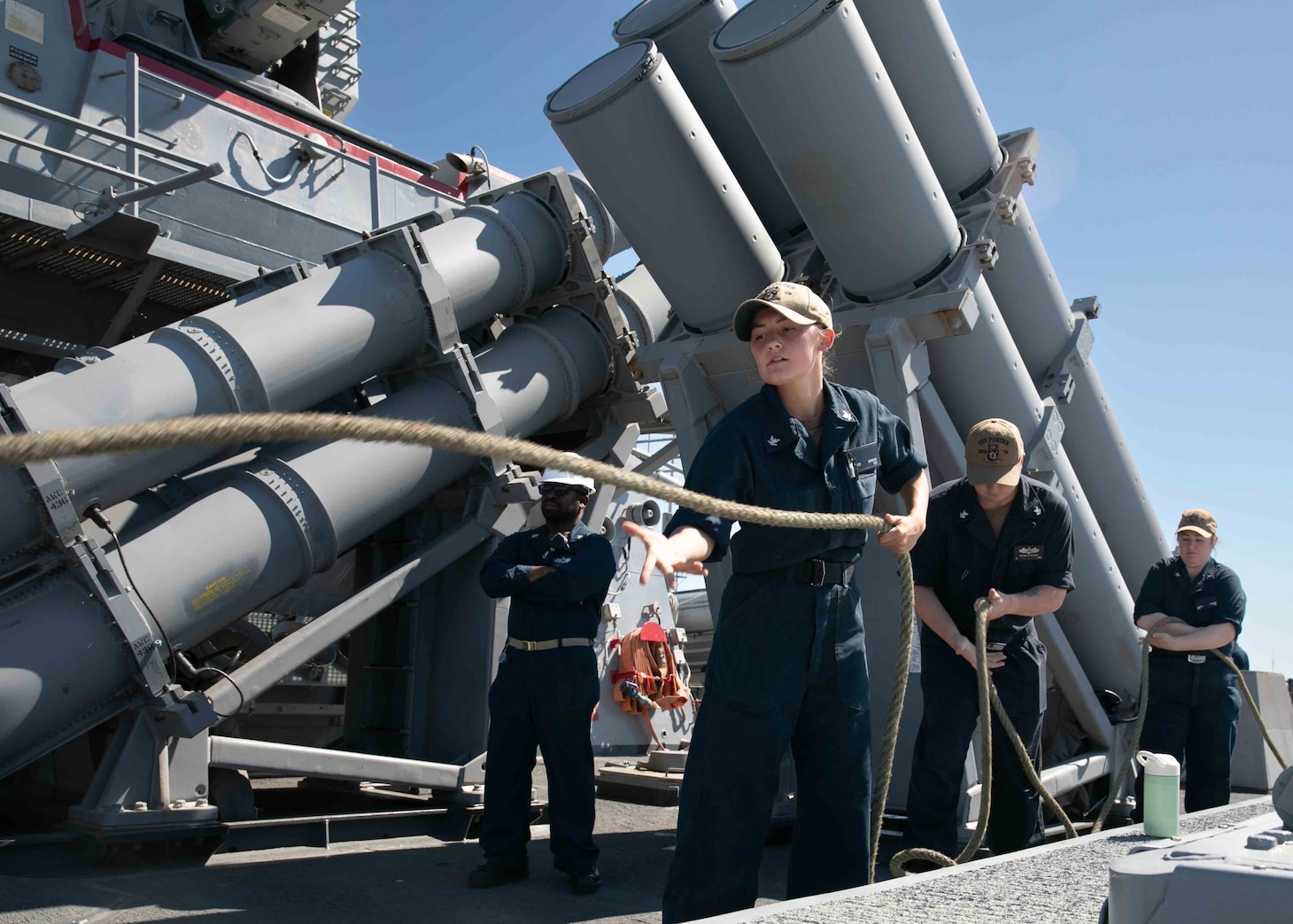 Interior Communications Electrician 3rd Class Hailey Servedo pulls the mooring lines aboard the Arleigh Burke-class guided-missile destroyer USS Porter (DDG 78), May 10, 2022. Porter is on a scheduled deployment in the U.S. Sixth Fleet area of operations in support of U.S., Allied and partner interest in Europe and Africa.