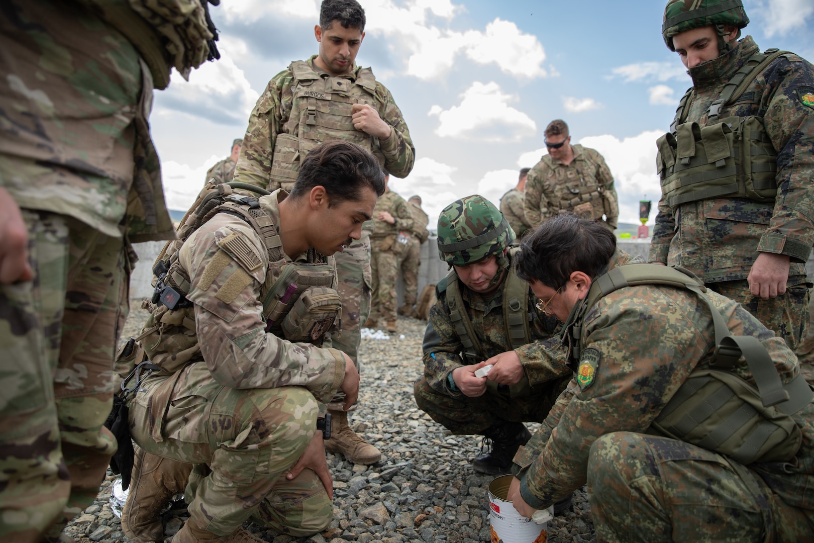 A soldier teaches Bulgarian soldiers.