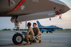 U.S. Air Force Senior Airman Michael Dang, crew chief with the 419th Aircraft Maintenance Squadron, shows Airman 1st Class Miguel Perez from 419th AMXS how to perform a routine pre-flight maintenance check on an F-35A Lightning II during exercise Sentry Savannah May 6, 2022.