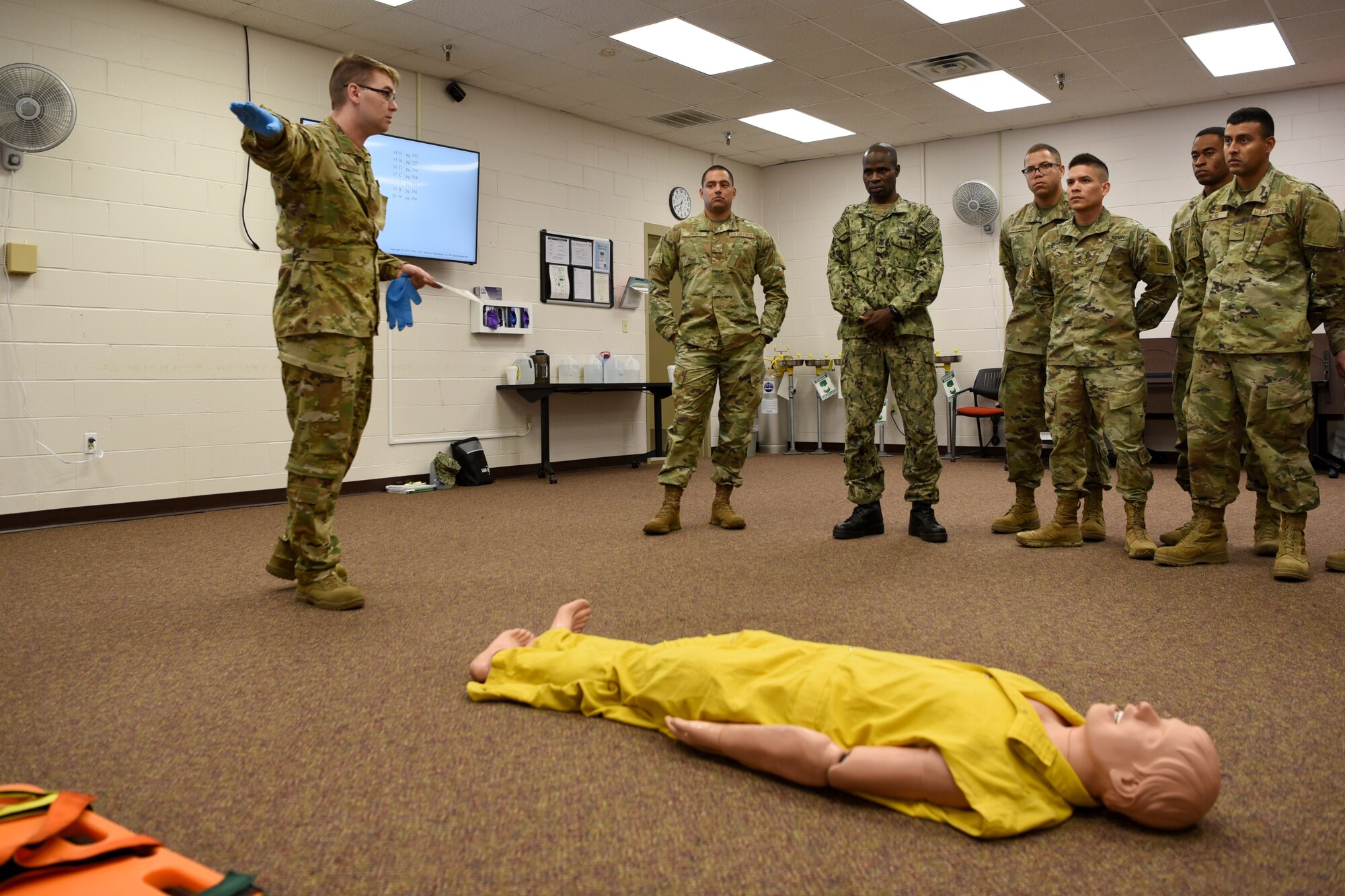 U.S. Air Force Staff Sgt. Robert Kirkpatrick, 312th Training Squadron instructor, teaches his students Emergency Medical Responder skills before a psychomotor evaluation at Goodfellow Air Force Base, Texas, May 6, 2022. Kirkpatrick passed an instructor qualification exam which was EMR specific for the Louis F. Garland Department of Defense Fire Academy. (U.S. Air Force photo by Senior Airman Abbey Rieves)