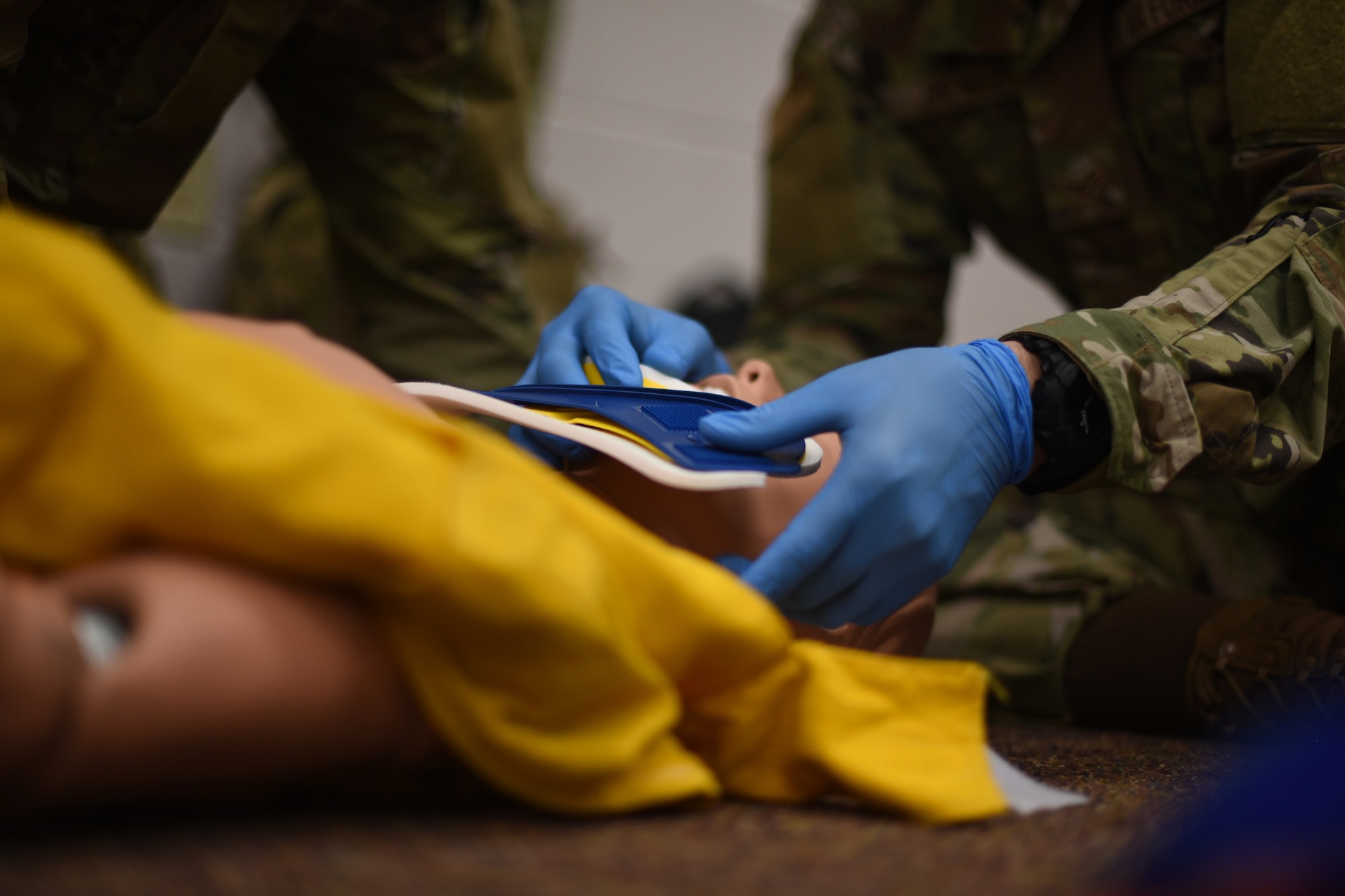 U.S. Air Force Airman 1st Class Joshua Jimenez, 312th Training Squadron student, applies a C-collar to stabilize a simulated victim’s spine, during an emergency medical responder psychomotor skills evaluation at Goodfellow Air Force Base, Texas, May 6, 2022. Students who successfully complete the 68-academic training days at Louis F. Garland Department of Defense Fire Academy, graduate and begin their career with five national certifications. (U.S. Air Force photo by Senior Airman Abbey Rieves)
