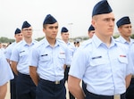 Airman Tomokazu Lewis stands in formation during his Basic Military Training graduation ceremony at Joint Base San Antonio-Lackland, Texas, April 21, 2022.