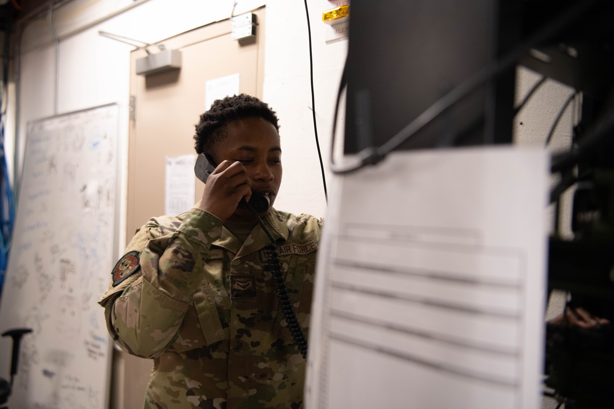 Airman 1st Class Savannah Wilson, 608th Air Communications Squadron radio frequency technician, performs a radio check in the 8th Air Force attic to ensure proper network connectivity. These tests ensure sure two-way communication is seamless in a time of need. (U.S. Air Force photo by Staff Sgt. Bria Hughes)