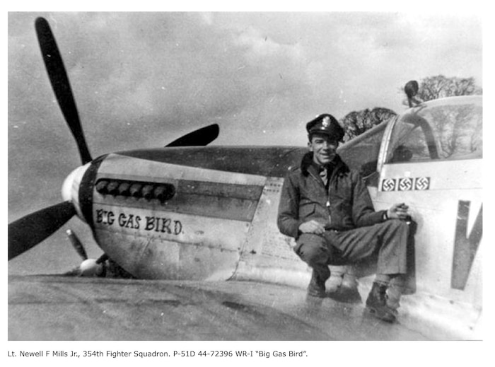 A photo of a pilot with his plane.