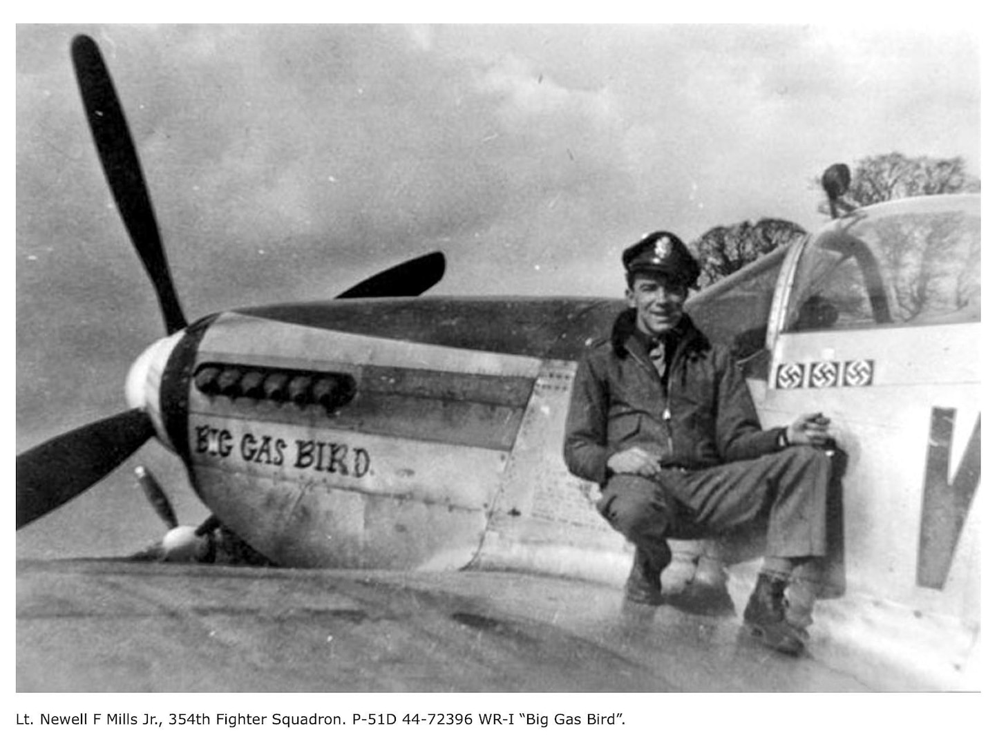 A photo of a pilot with his plane.