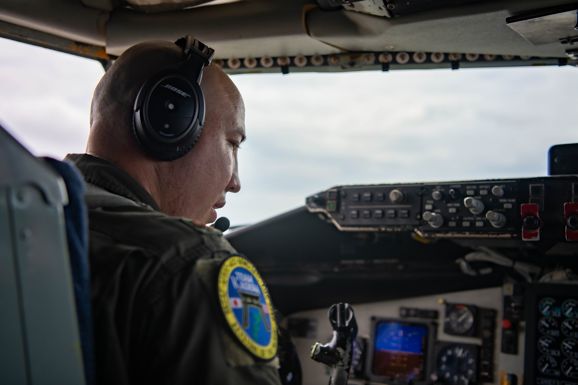A pilot prepares for takeoff in the cockpit.
