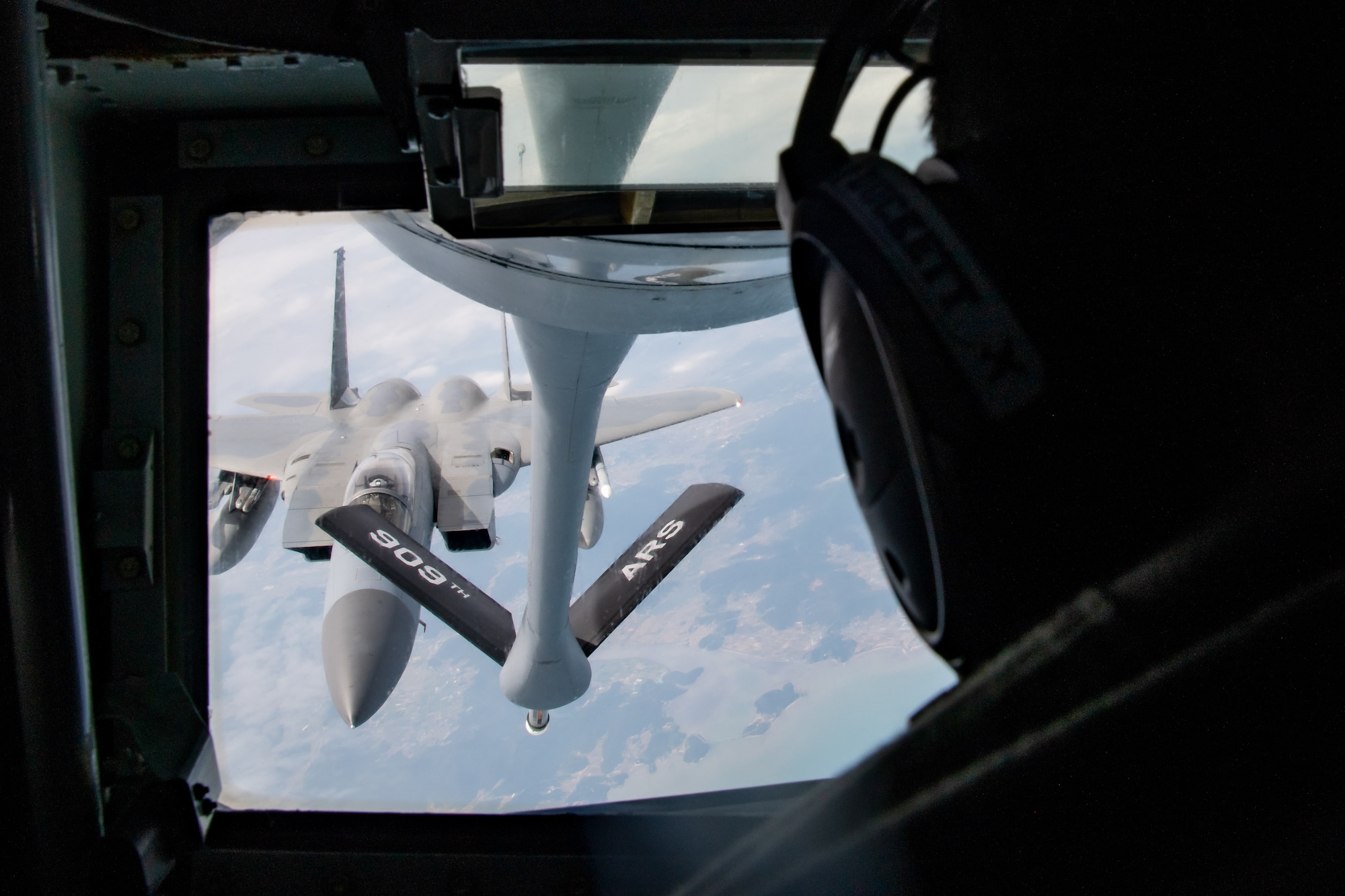 An F-15 Eagle is refueled in the air.