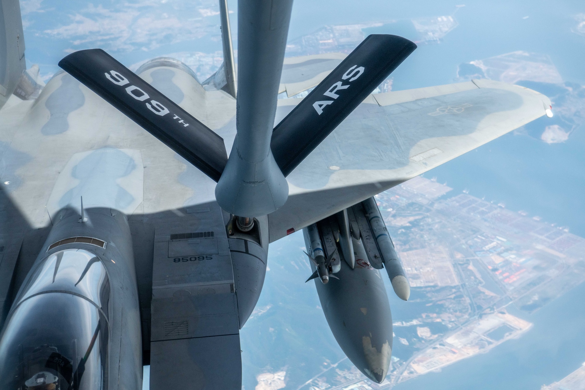 An F-15 Eagle is refueled in the air.