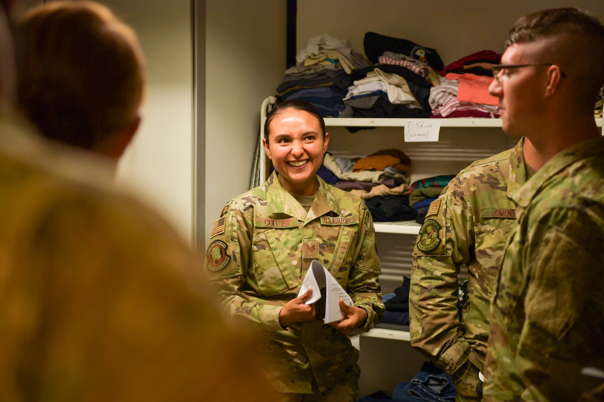 U.S. Air Force Staff Sgt. Jacqueline Collosi, 86th Mission Support Squadron Detachment 1Deployment Transition Center resilient trainer at, guides redeployers on a tour of the DTC at Ramstein Air Base, Germany, May 3, 2022.