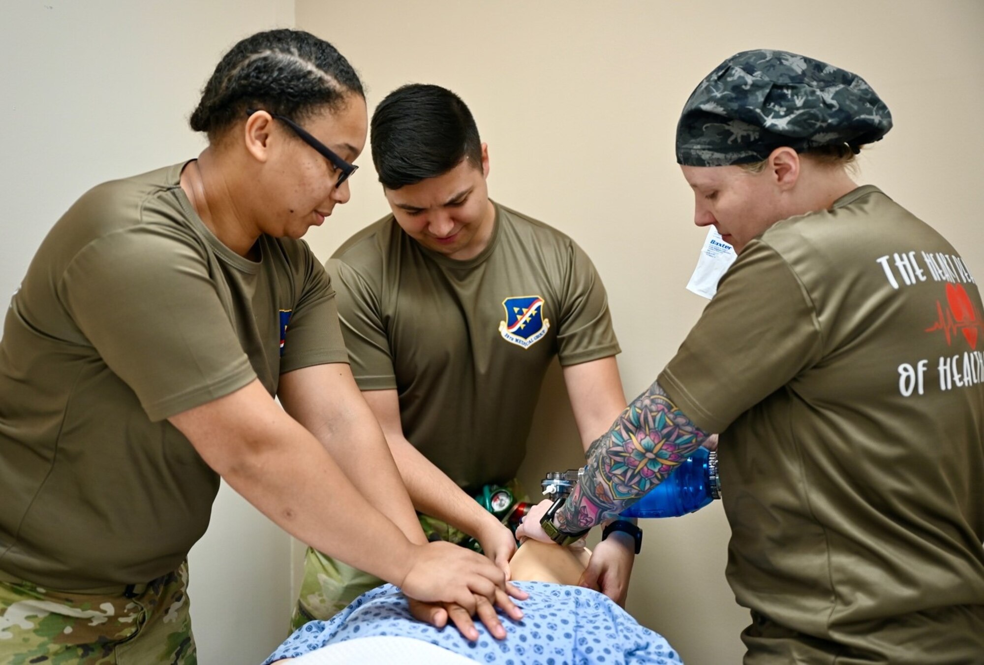 Medical personnel from various sections of the 39th Medical Group simulate resuscitating a patient during a lifesaving medical training exercise in honor of National Nurse and Medical Technicians Week at Incirlik Air Base, May 6, 2022. National Nurses and Tech Week occurs annually from May 6-12 and provides an opportunity to recognize members serving in these professions and cultivate a sense of community appreciation for their work. (U.S. Air Force photo by Staff Sgt. Gabrielle Winn)
