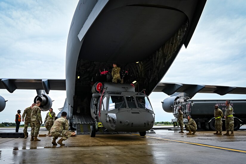 A U.S. Army UH-60M Blackhawk assigned to the 150th Aviation Regiment upload onto a C-17 Globemaster III on May 6, 2022, at Joint Base McGuire-Dix-Lakehurst, N.J. The Black Hawk offers pilots seats that are protected with heavy armor, and an armored fuselage capable of withstanding hits from guns with up to 23mm shells. It can also operate safely in the majority of severe weather conditions due to its wide array of advanced avionics.