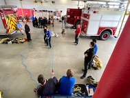 Students from Smith Vocational and Agricultural High School tour the 104th Fighting Wing May 6, 2022, at Barnes Air National Guard Base, Massachusetts.  The firefighters setup skills stations for the students to practice CPR and rescue techniques.  The students visited the Fire Department, Security Forces Squadron, and the Logistics Readiness Squadron.  The 104FW public affairs team has an annual base tour program April - October open to community youth groups and local employers to strengthen partnerships.  (U.S Air National Guard Photos by Master Sgt. Lindsey S. Watson)