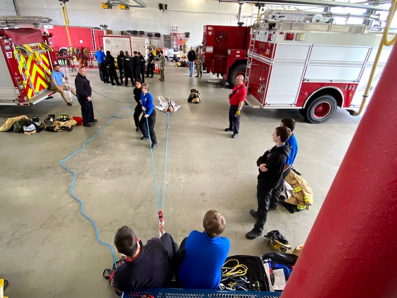Students from Smith Vocational and Agricultural High School tour the 104th Fighting Wing May 6, 2022, at Barnes Air National Guard Base, Massachusetts.  The firefighters setup skills stations for the students to practice CPR and rescue techniques.  The students visited the Fire Department, Security Forces Squadron, and the Logistics Readiness Squadron.  The 104FW public affairs team has an annual base tour program April - October open to community youth groups and local employers to strengthen partnerships.  (U.S Air National Guard Photos by Master Sgt. Lindsey S. Watson)