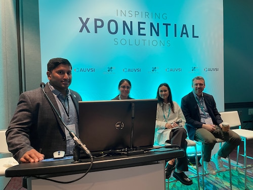 Darshan Divakaran moderates an AFWERX team panel featuring Verenice Mondragon-Jaimes from Spark, Nicole Quattrociocchi from Orbital Prime and Maj. James Colraine from AFVentures at AUVSI XPONENTIAL 2022, an advanced air mobility convention in Orlando, Fla., April 26, 2022. (U.S. Air Force photo / Ciska Bloemhard)