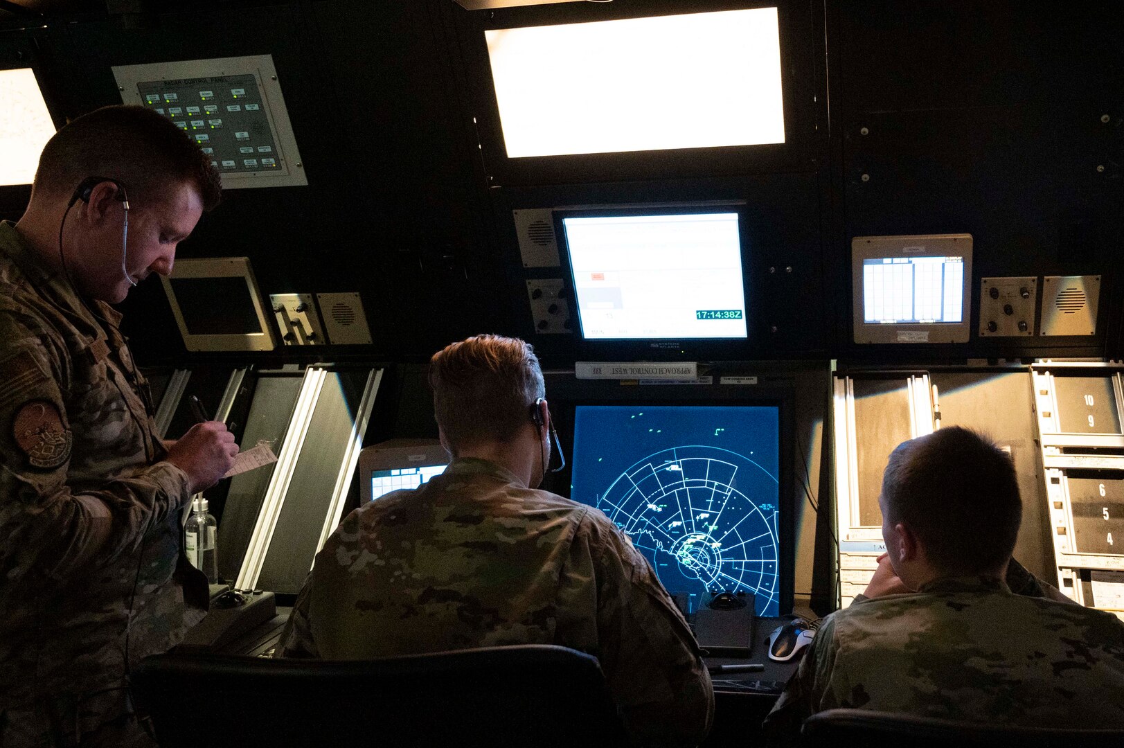 U.S. Air Force Senior Airman Robert Taggart (left), Airman 1st Class Christopher Morley (middle), and Airman 1st Class Caze Bradley (right), 47th Operations Support Squadron air traffic controllers, work together during a simulated air traffic control session at Laughlin Air Force Base, Texas, May 4, 2022. This simulator allows Airmen to train for day-to-day air traffic scenarios without the stress of real-world situations.
