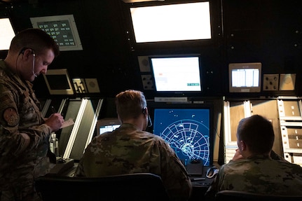 U.S. Air Force Senior Airman Robert Taggart (left), Airman 1st Class Christopher Morley (middle), and Airman 1st Class Caze Bradley (right), 47th Operations Support Squadron air traffic controllers, work together during a simulated air traffic control session at Laughlin Air Force Base, Texas, May 4, 2022. This simulator allows Airmen to train for day-to-day air traffic scenarios without the stress of real-world situations.