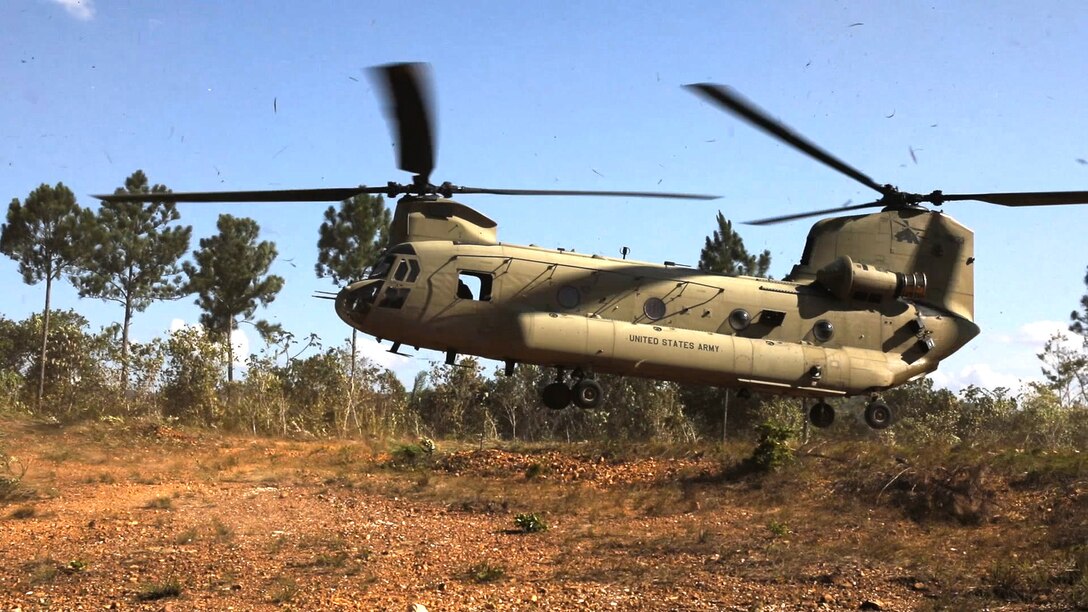 A military helicopter lands.