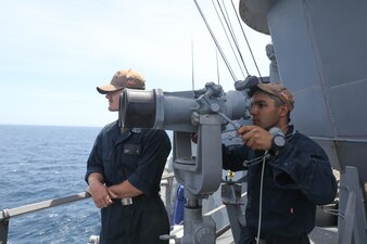 Sailors stand starboard lookout aboard USS Porter (DDG 78).
