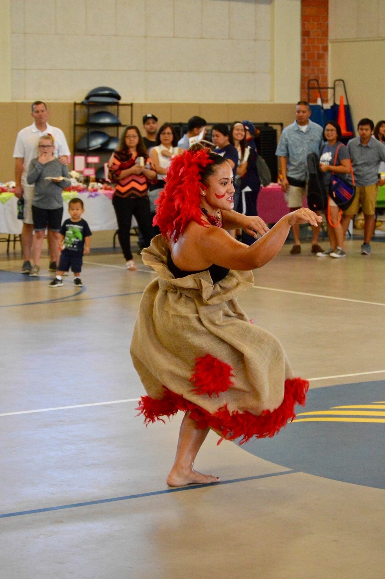 U.S. Air Force Master Sgt. Gloria Florentine Siliako-Nautu, 17th Security Forces Squadron noncommissioned officer in charge of operations, performs a traditional dance. Siliako-Nautu is Samoan and is from the island of American Samoa located southwest of Hawaii. Siliako-Nautu volunteered to participate in the 17th Training Wing’s Asian American Pacific Islander Heritage Month observance. (Courtesy photo)