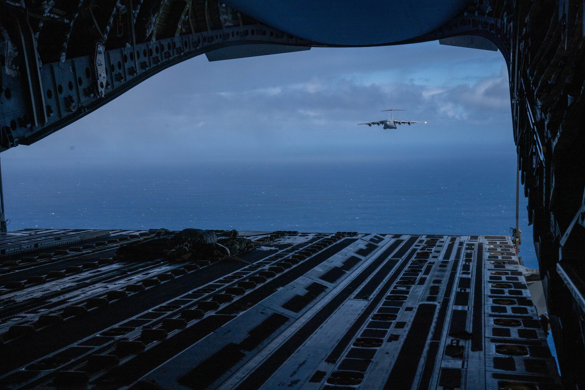 A Royal Australian Air Force C-17 Globemaster III flies over the Pacific Ocean during Exercise Global Dexterity 2022 at Joint Base Pearl Harbor-Hickam, Hawaii, May 4, 2022. Exercise Global Dexterity included side-by-side training of C-17s from the U.S. Air Force, Hawaii Air National Guard, and the Royal Australian Air Force to better develop tactics between the three forces. (U.S. Air Force photo by Airman 1st Class Makensie Cooper)