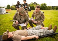 Joint Base Andrews medical personnel practice tactical combat casualty care during the Expeditionary Medical Support System exercise at JBA, Md., May 5, 2022.