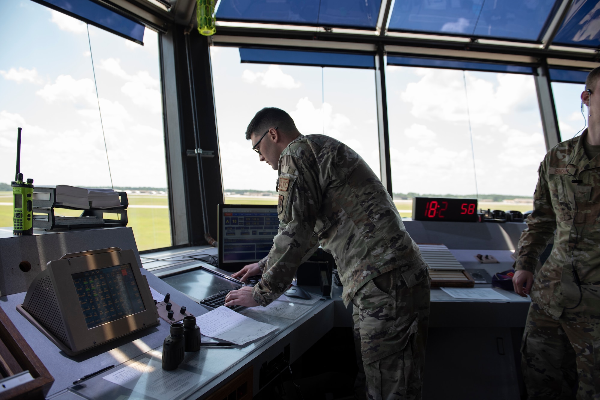 A photo of a person working on a monitor