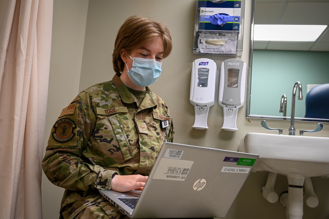 U.S. Air Force Airman First Class Renee York, Operational Medical Readiness Squadron medical technician, fills out information on a laptop at Altus Air Force Base, Oklahoma, May 9, 2022. York said she became a technician to not only help people but help further her medical career. (U.S. Air Force photo Senior Airman Kayla Christenson)