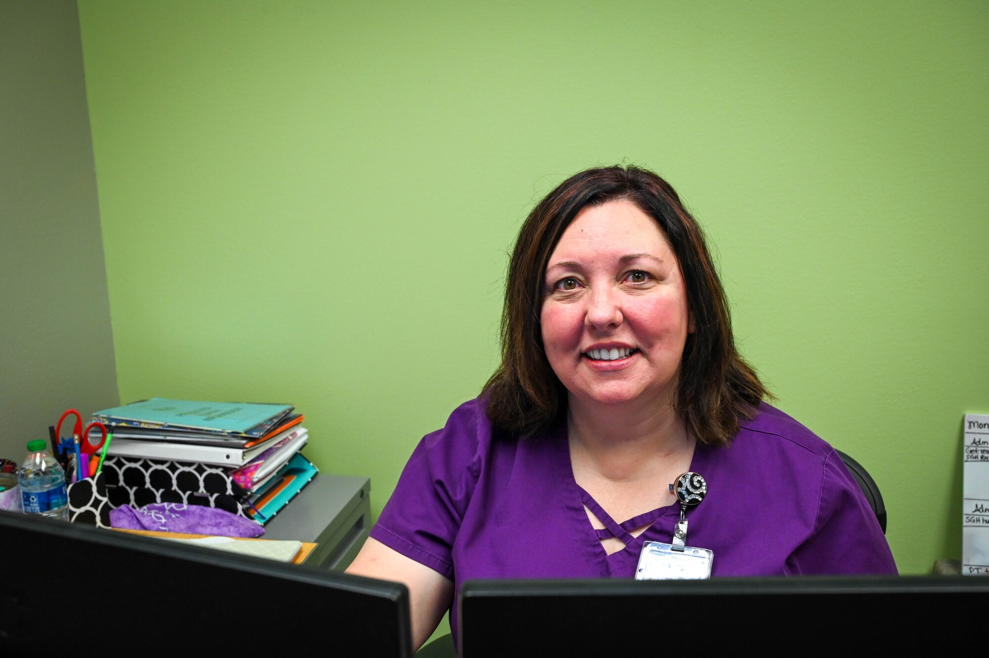 Sandy Lawson, 97th Operational Medical Readiness Squadron healthcare integrator, poses for a photo at Altus Air Force Base, Oklahoma, May 9, 2022. Lawson said she became a nurse because, when she was having her second child, her labor and delivery nurse was so amazing that it really inspired her to become one. (U.S. Air Force photo Senior Airman Kayla Christenson)