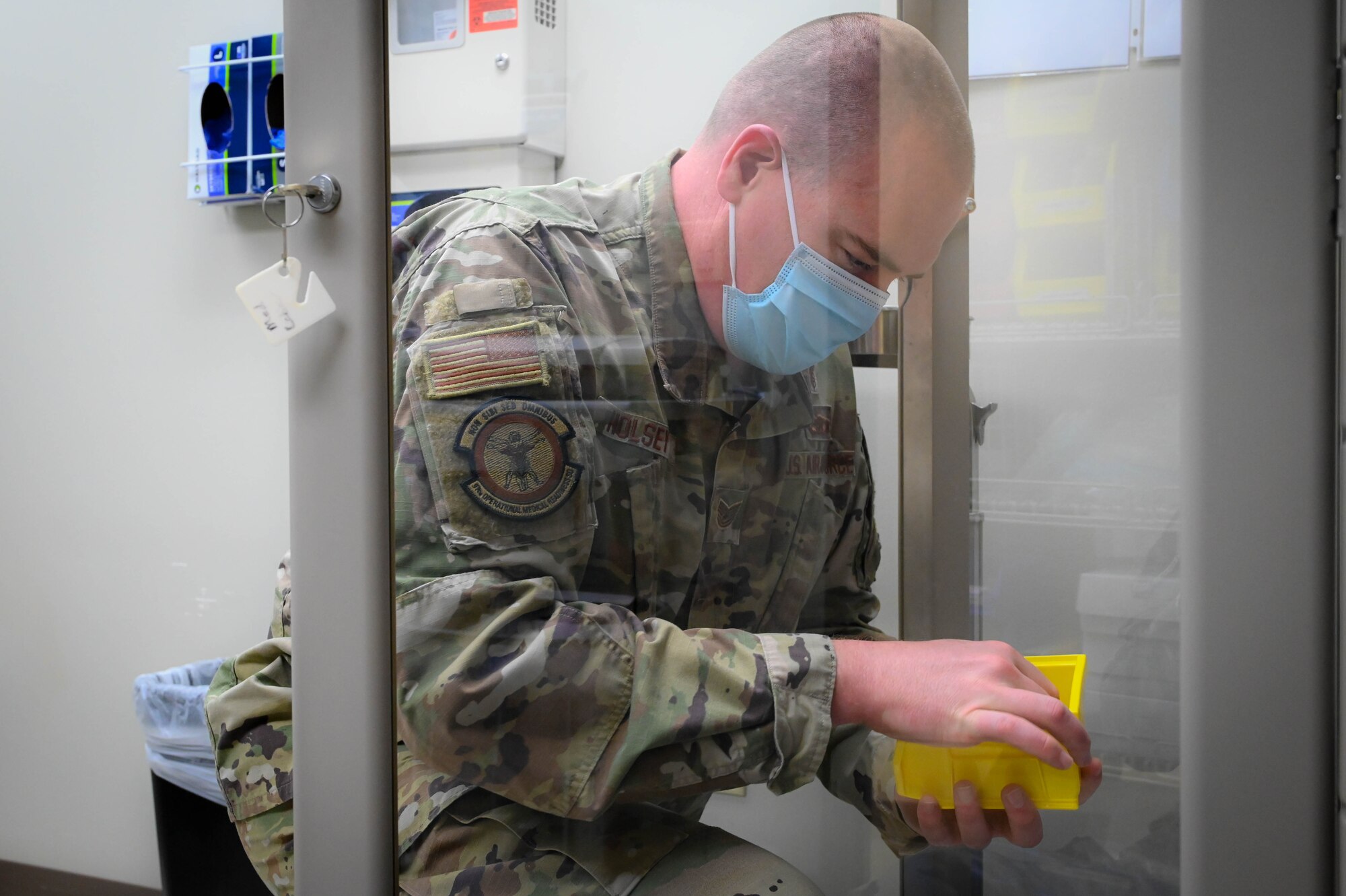 U.S. Air Force Tech. Sgt. Kenneth Holsey, 97th Operational Medical Readiness Squadron flight and operational medical clinic noncommissioned officer in charge, checks inventory at Altus Air Force Base (AAFB), Oklahoma, May 9, 2022. Holsey said his favorite parts of being a medical technician are responding to medical alerts, taking care of aircrew members and enabling the continuation of training for AAFB students. (U.S. Air Force photo Senior Airman Kayla Christenson)
