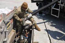 Senior Airman Turkovitz, 5th Logistics Readiness Squadron fuels equipment maintenance lead, prepares to fuel a B-52H Stratofortress for its next mission at Minot Air Force Base, North Dakota, April 26, 2022. The B-52 uses 3,300 gallons of fuel every hour of flight. (U.S. Air Force photo by Airman 1st Class Alexander Nottingham)