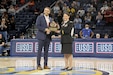 Alex Teodosi, left, Vice President of Sponsorship, Chicago Sky, presents a plaque to U.S. Army Reserve Maj. Jodi Wernikoff, headquarters and headquarters company commander of the 85th U.S. Army Reserve Support Command during the WNBA’s Chicago Sky’s home game versus the New York Liberty, May 12, 2022.