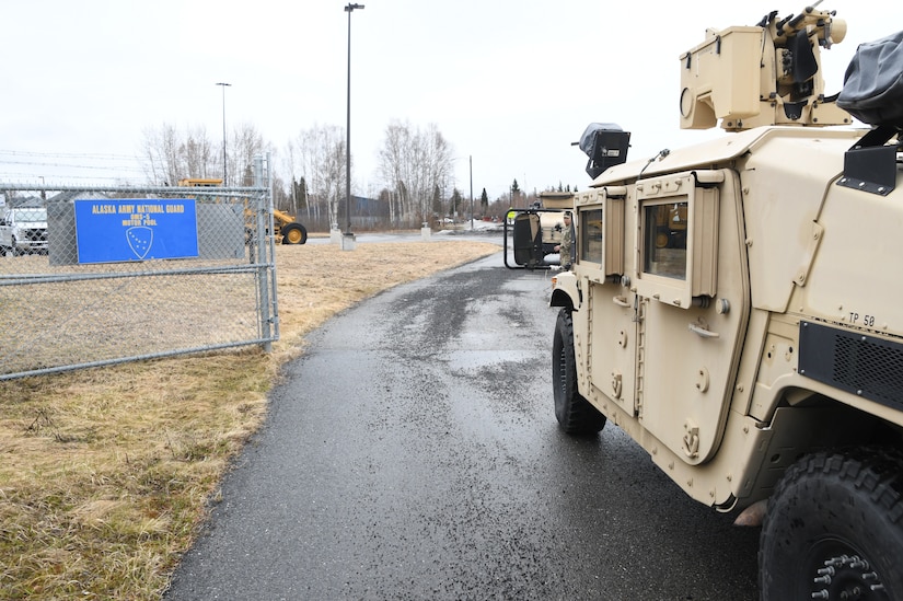 Alaska Army National Guard Soldiers, Sgt. Fabrain Alexander, Spc. Steven Romero and Pfc. Harlan Hartman of the 297th Military Police Company, Pvt. Frederica Rivers of the 207th Engineer Company, and Spc. Kyle Johnson of the 297th Regional Support Group depart the Fairbanks National Guard Armory en route to Manley Hot Springs, Alaska, May 12, 2022, to support flood recovery operations. The Guardsmen will assist with cleanup and flood recovery efforts at the request of the State of Alaska Emergency Operations Center. (Alaska National Guard photo by Senior Master Sgt. Julie Avey)