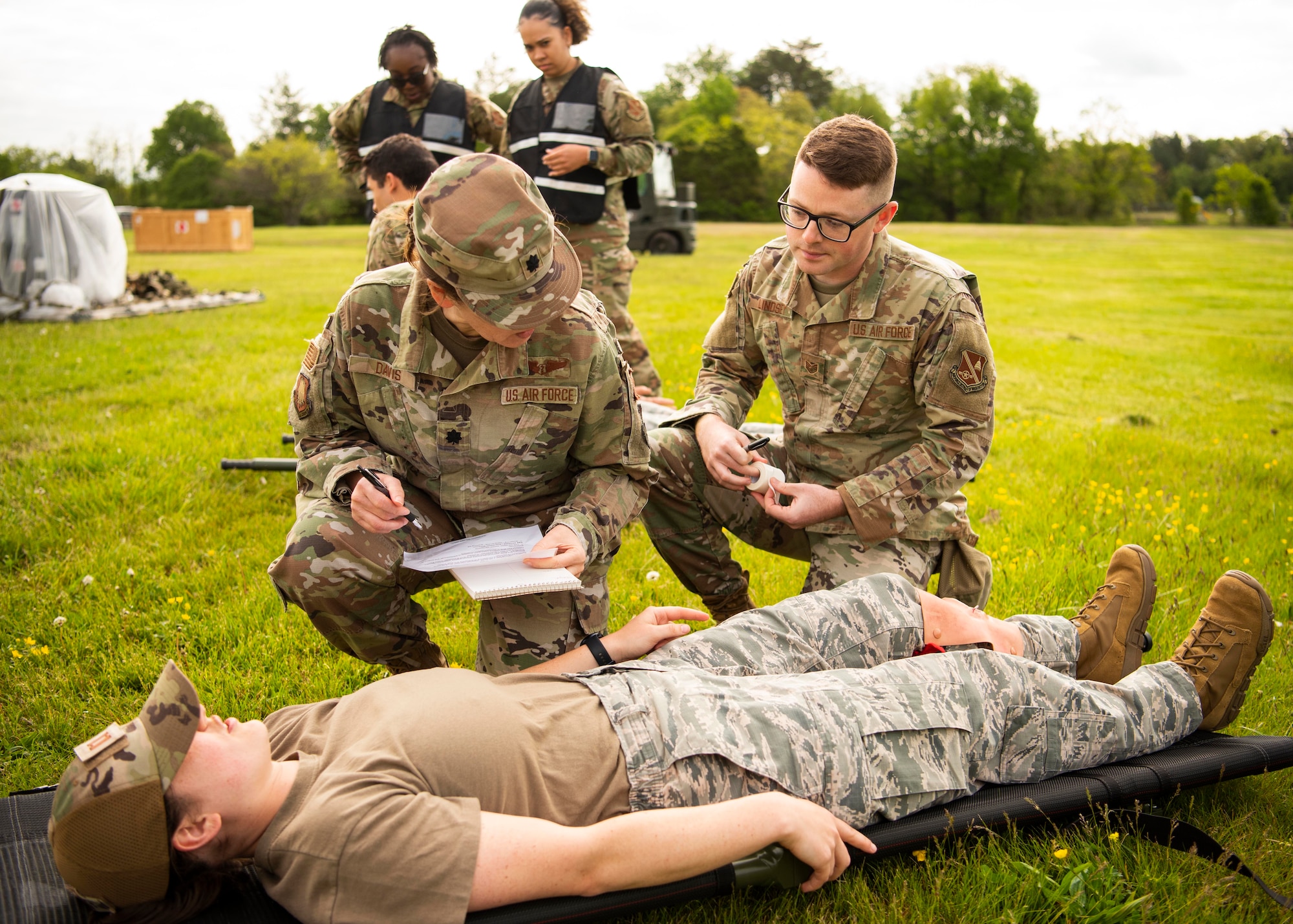 Joint Base Andrews medical personnel practice tactical combat casualty care during the Expeditionary Medical Support System exercise at JBA, Md., May 5, 2022.