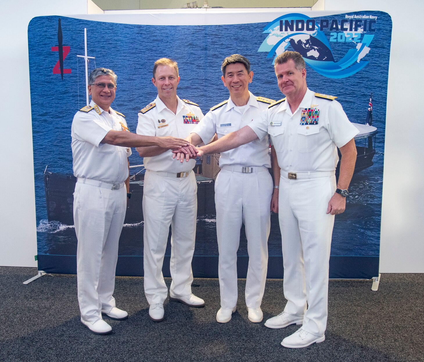 Adm. Samuel Paparo, Commander, U.S. Pacific Fleet, poses for a photo with Indian Navy Vice Adm. Biswajit Dasgupta, Royal Australian Navy Vice Adm. Michael Noonan, and Japan Maritime Self Defense Force Adm. Ryo Sakai.
