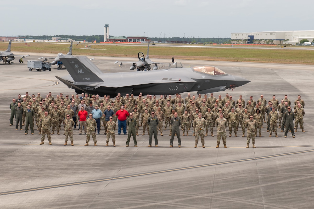 Members of the 419th Fighter Wing stand on the flightline at the Air Dominance Center May 6, 2022.